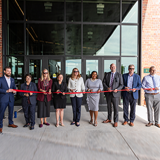 Group photo at R8 building 48 ribbon cutting September 2024 