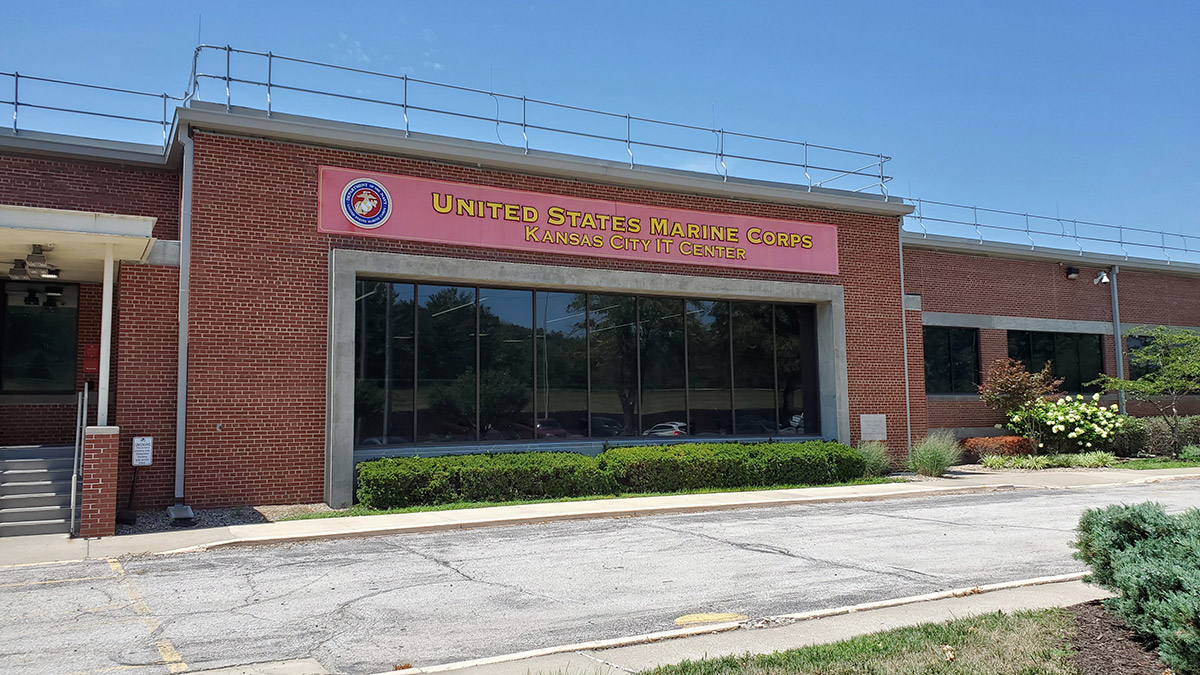 Entrance to a red brick building with the sign United States Marine Corps, Kansas City IT Center