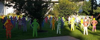 Multi-colored life-size silhouette sculptures of 200 youth