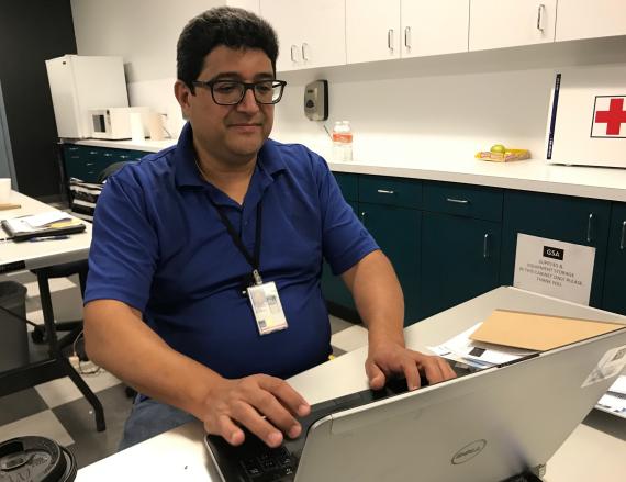 Ed Perez working at desk