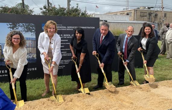 Courthouse Groundbreaking Event in Greenville, Mississippi - Individuals with Shovels Throwing Dirt to Signify Construction Start