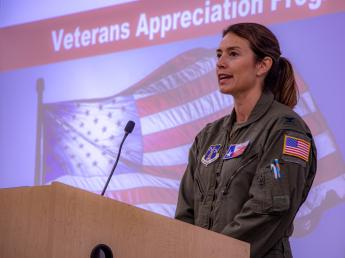 Colonel Pynes speaks to the crowd about her military experience.