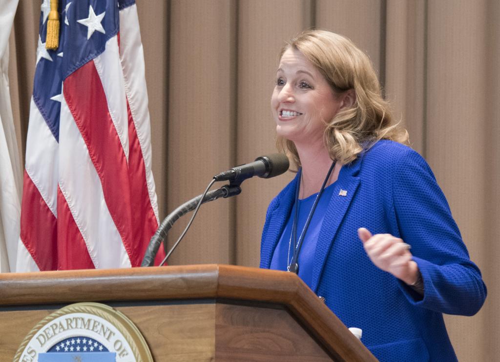 Suzette Kent, Federal CIO, OMB presents opening remarks for the Women in Federal IT & Cyber event in the Jefferson Auditorium