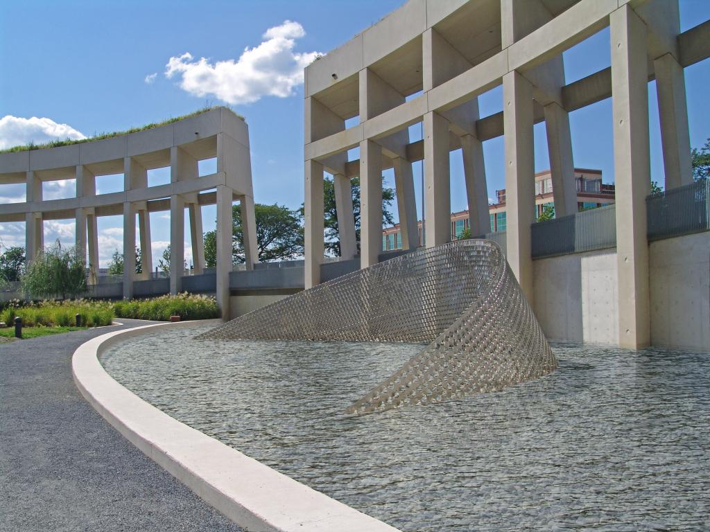 Ned Kahn, Quantum Wave, 2008. The entire surface of this tilted arc is covered with three-inch stainless steel disks that are hinged to move in the wind.