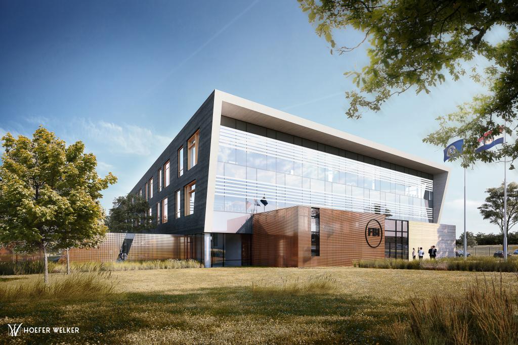 A beige and glass two story building with with a circle and FBI in it on the front.