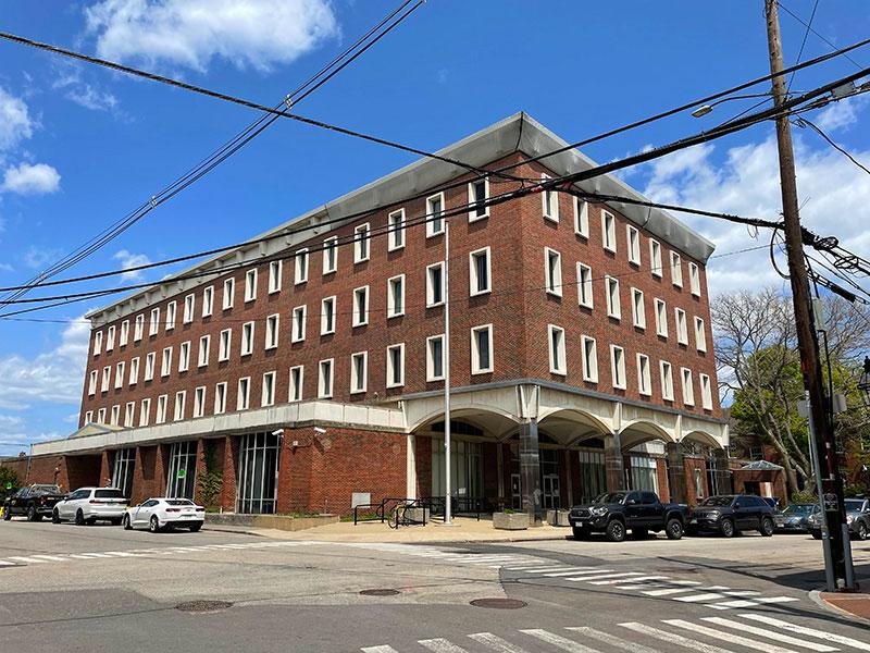 View of a 4-story red-brick building on a corner