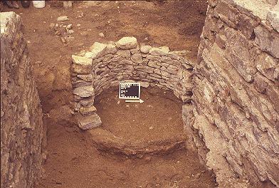 Feature H, a stone-lined privy, located at Number 8 Baxter Street (lot 45)