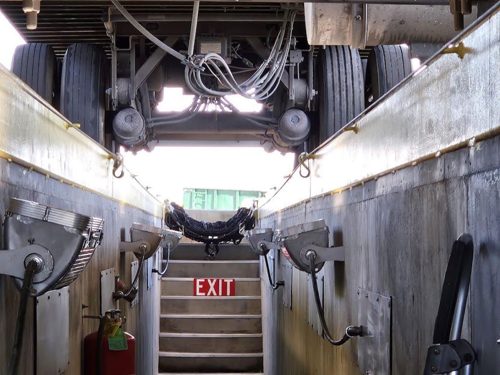 A truck getting inspected with upgraded tunnel lighting