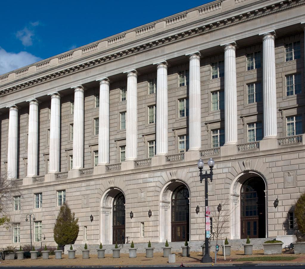 IRS stone building facade, with arched doorways and columns